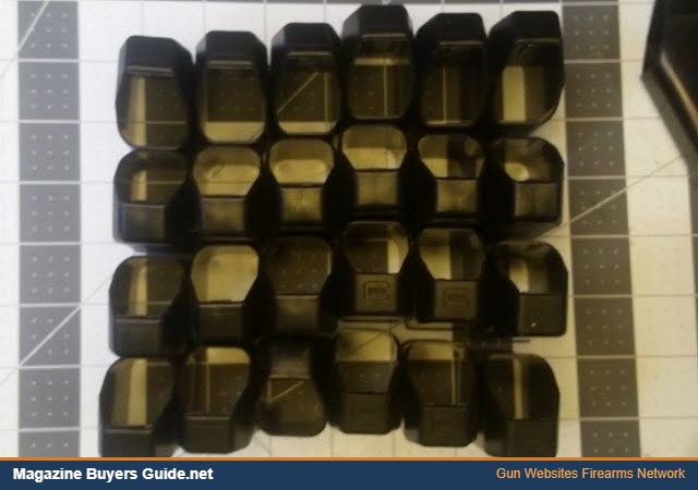 A collection of Glock magazine loaders