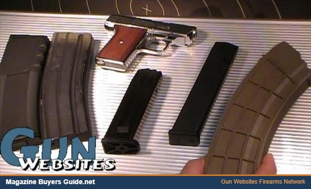 Pistol and rifle magazines laid out next to a handgun