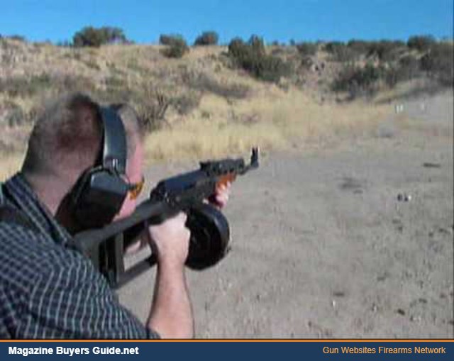 Shooting an AK with a drum magazine at the range